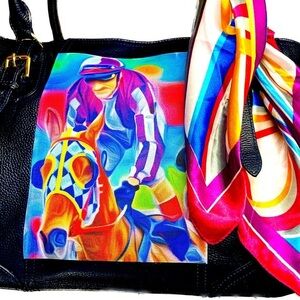 Leather in navy with no wear and a jockey motif on canvas applied to the side.